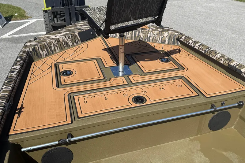 Slide: The Image of 2026 Avid 18 Rogue CC boat deck with camo accents and measurement markings. - 15