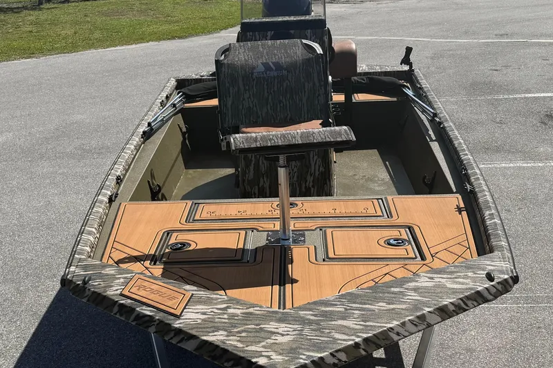Slide: The Image of 2026 Avid 18 Rogue CC boat with camouflage design and wooden deck. - 8