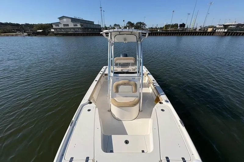Slide: The Image of 2016 KEYWEST 210 BR boat on calm water near a dock. - 13
