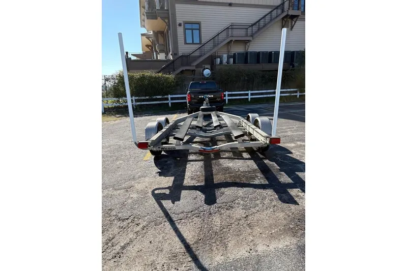 Slide: The Image of Trailer for 2016 KEYWEST 210 BR boat parked outdoors. - 18