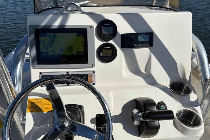 Slide: The Image of Steering console of 2016 KEYWEST 210 BR boat with navigation and control instruments. - 6