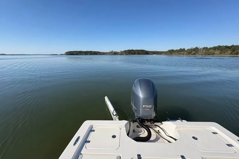 Slide: The Image of 2016 KEYWEST 210 BR boat on calm water with clear blue sky. - 8