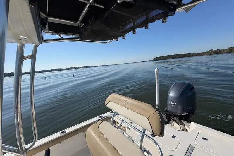 Slide: The Image of 2016 KEYWEST 210 BR boat cruising on calm waters under clear blue sky. - 9
