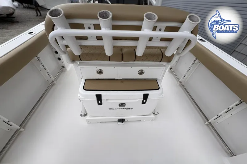Slide: The Image of 2019 Sportsman Open 232 Center Console boat interior with rod holders and storage. - 11