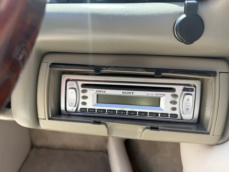 Slide: The Image of A Sony car stereo is installed in the dashboard of a 2002 Crownline 202 BR boat. - 28