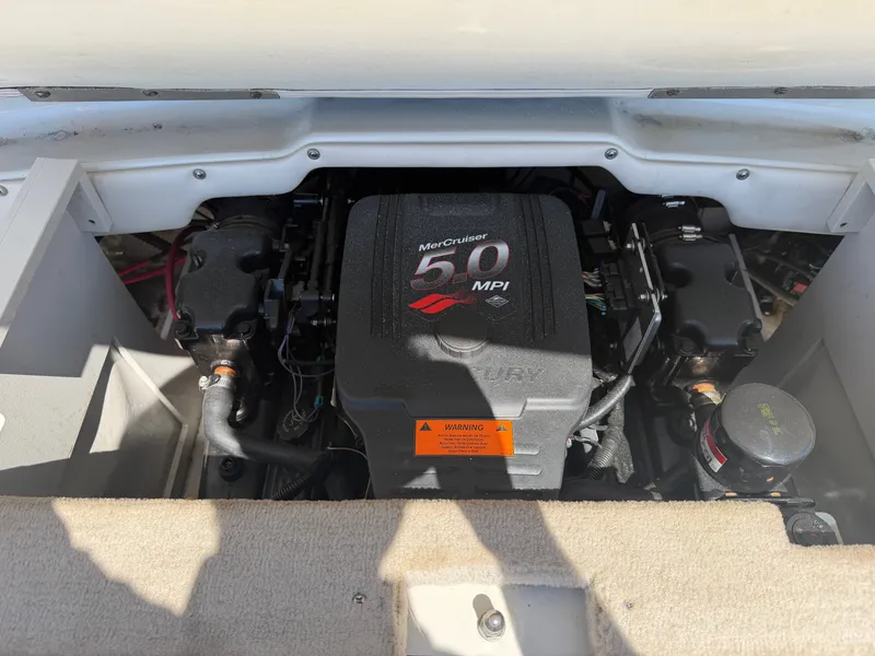 Slide: The Image of A MerCruiser 5.0 MPI engine in a 2002 Crownline 202 BR boat. - 14