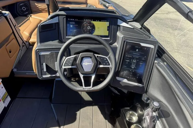 Slide: The Image of 2025 Supra SA boat dashboard with modern steering wheel and digital displays. - 13