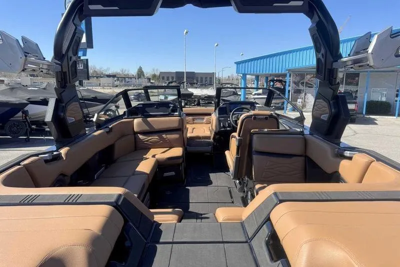 Slide: The Image of Interior of 2025 Supra SA boat with luxurious seating and modern design. - 7