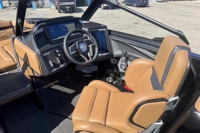 Slide: The Image of 2025 Supra SA boat interior with tan leather seats and modern dashboard. - 8
