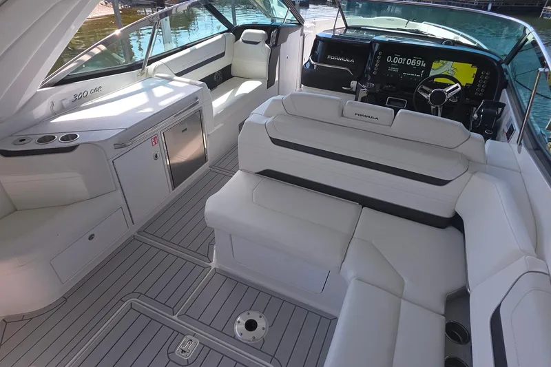 Slide: The Image of 2026 Formula 360 Crossover Bowrider I/O interior with luxurious seating and modern dashboard. - 15