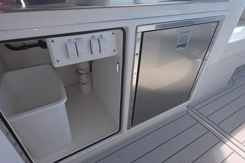 Slide: The Image of 2026 Formula 360 Crossover Bowrider I/O interior with control panel and storage. - 18