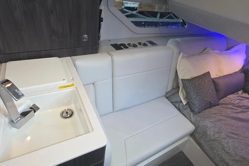 Slide: The Image of Luxurious interior of 2026 Formula 360 Crossover Bowrider I/O with sink and seating area. - 32