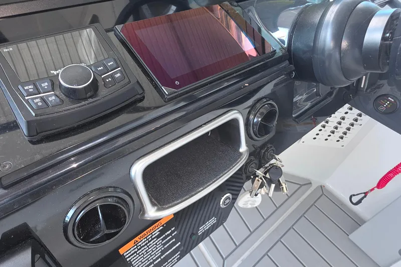 Slide: The Image of Dashboard of 2026 Formula 360 Crossover Bowrider I/O with controls and keys. - 41