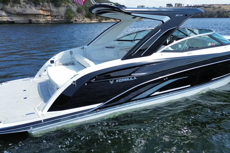 Slide: The Image of 2026 Formula 360 Crossover Bowrider I/O on water, sleek design, luxury boating experience. - 5
