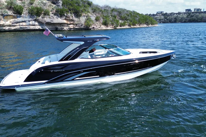 Slide: The Image of 2026 Formula 360 Crossover Bowrider I/O cruising on a scenic lake. - 8