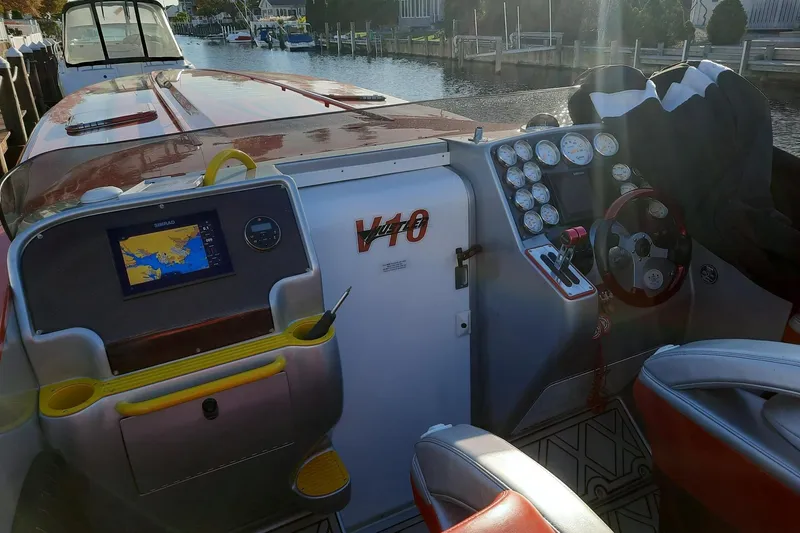 Slide: The Image of Cockpit of 2005 Hustler 388 SLINGSHOT boat with navigation system and gauges. - 10