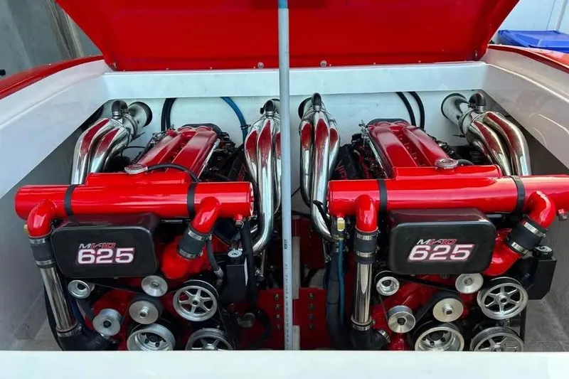 Slide: The Image of Twin Mercury 625 engines in a 2005 Hustler 388 SLINGSHOT boat. - 18