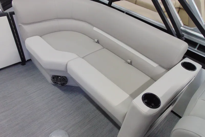 Slide: The Image of Luxurious seating on 2026 Godfrey EX 2086 CX boat with cup holders and speaker. - 11