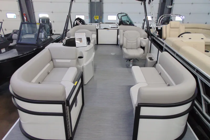 Slide: The Image of 2026 Godfrey EX 2086 CX pontoon boat interior with plush seating and modern design. - 4