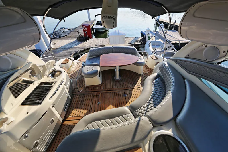Slide: The Image of Luxurious 2008 Cranchi Mediterranee 43 yacht interior with elegant seating and wooden deck. - 11