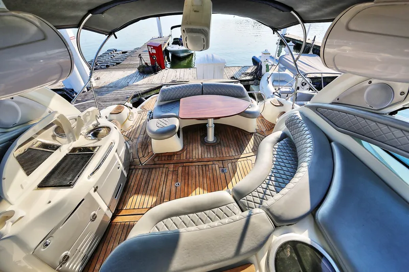 Slide: The Image of Luxurious 2008 Cranchi Mediterranee 43 yacht interior with elegant seating and wooden flooring. - 12