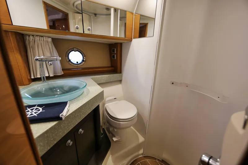 Slide: The Image of Luxurious bathroom in 2008 Cranchi Mediterranee 43 yacht with modern fixtures and porthole window. - 20