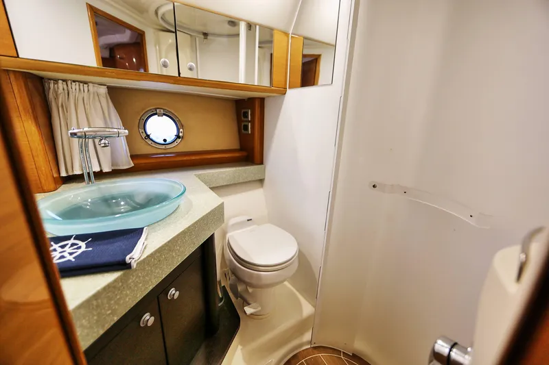 Slide: The Image of Luxurious bathroom in 2008 Cranchi Mediterranee 43 yacht with modern fixtures and porthole window. - 21