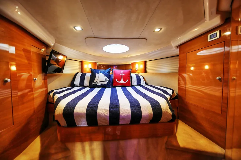 Slide: The Image of Luxurious cabin interior of 2008 Cranchi Mediterranee 43 yacht with striped bedding. - 23