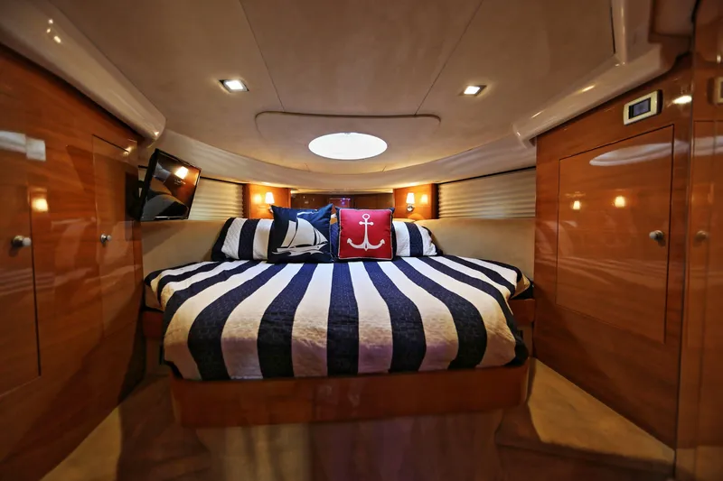 Slide: The Image of Luxurious cabin interior of 2008 Cranchi Mediterranee 43 yacht with striped bedding. - 26