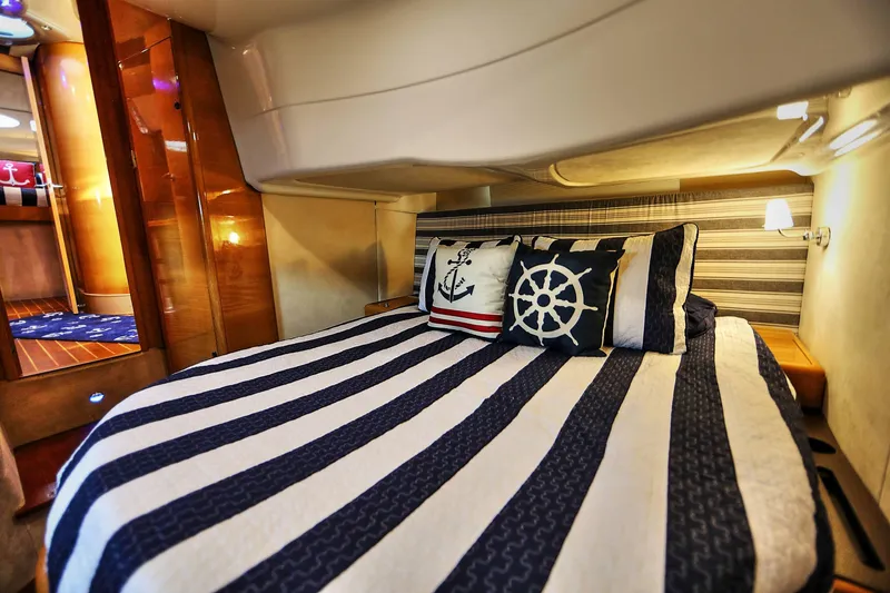 Slide: The Image of Luxurious cabin interior of 2008 Cranchi Mediterranee 43 yacht with nautical-themed bedding. - 27