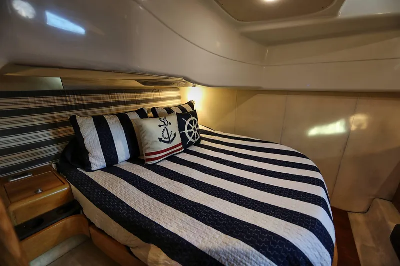 Slide: The Image of Cozy cabin interior of 2008 Cranchi Mediterranee 43 with nautical-themed bedding. - 28