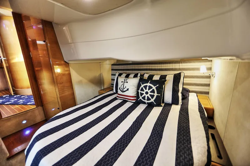 Slide: The Image of Luxurious cabin interior of 2008 Cranchi Mediterranee 43 yacht with nautical-themed bedding. - 30