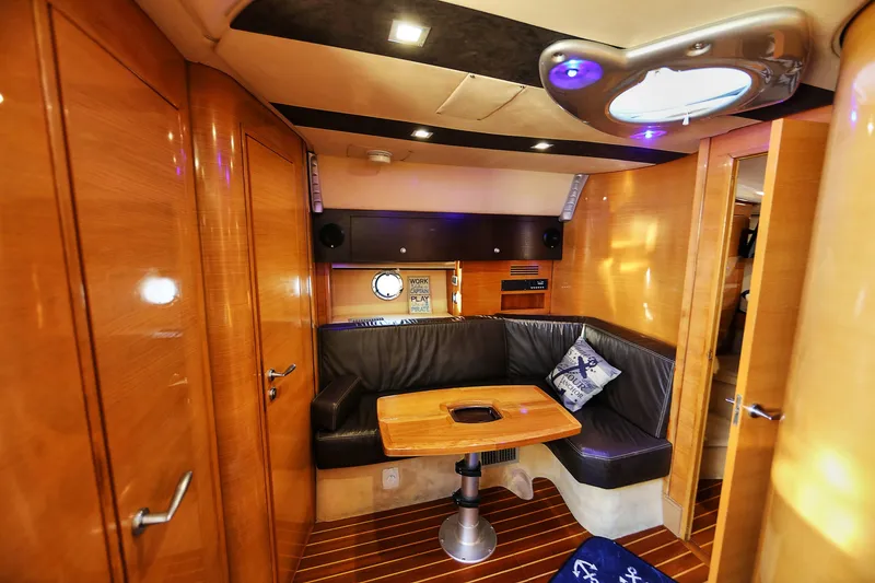 Slide: The Image of Luxurious interior of 2008 Cranchi Mediterranee 43 yacht with wood finish and leather seating. - 32
