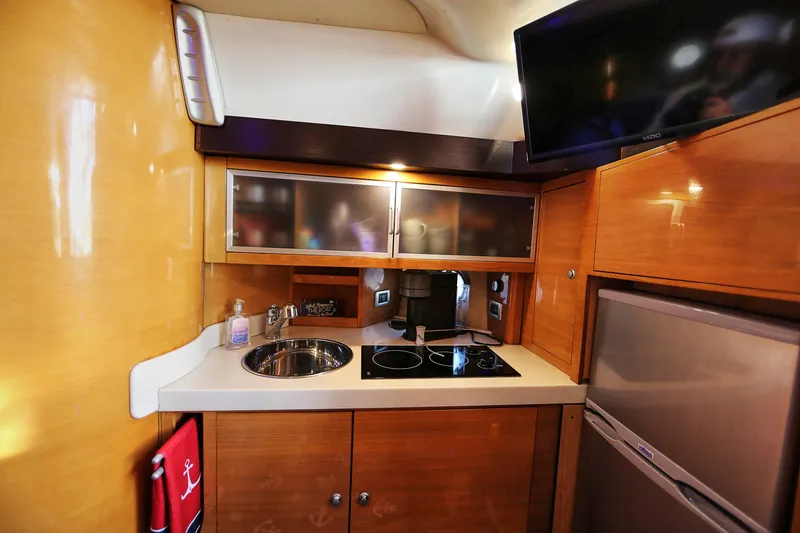 Slide: The Image of Compact kitchen area in 2008 Cranchi Mediterranee 43 yacht with modern amenities. - 37