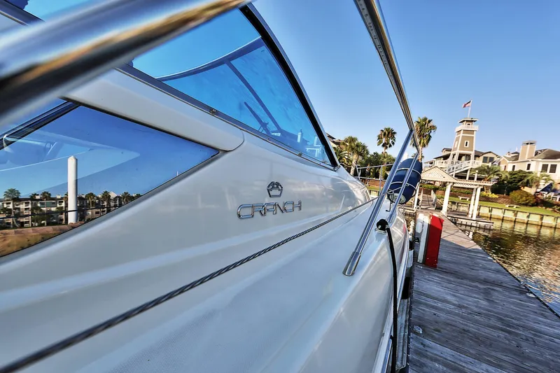 Slide: The Image of 2008 Cranchi Mediterranee 43 yacht docked at a scenic marina. - 38