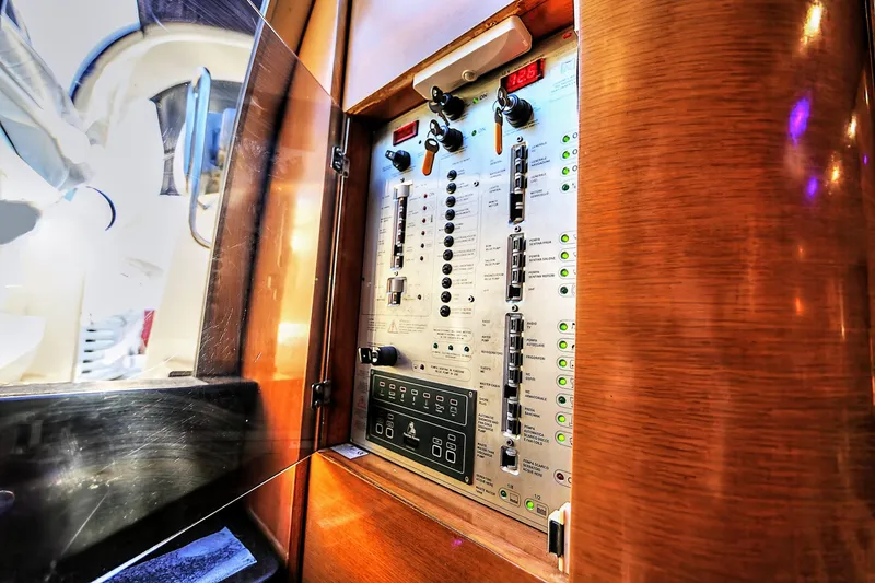 Slide: The Image of Control panel inside 2008 Cranchi Mediterranee 43 yacht, featuring switches and indicators. - 40