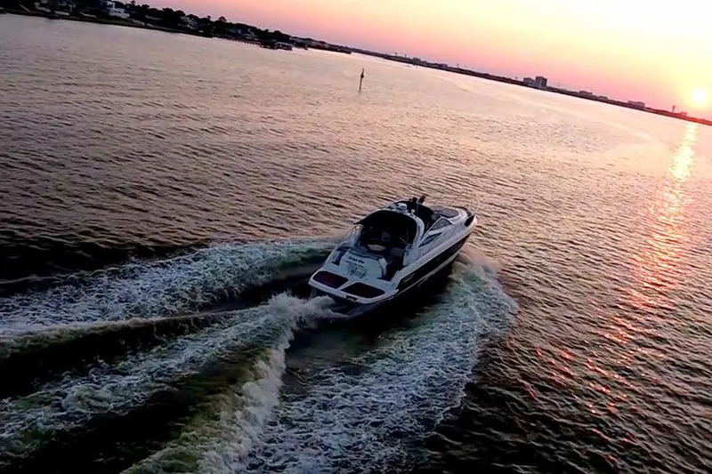 Slide: The Image of 2008 Cranchi Mediterranee 43 yacht cruising at sunset on open water. - 42