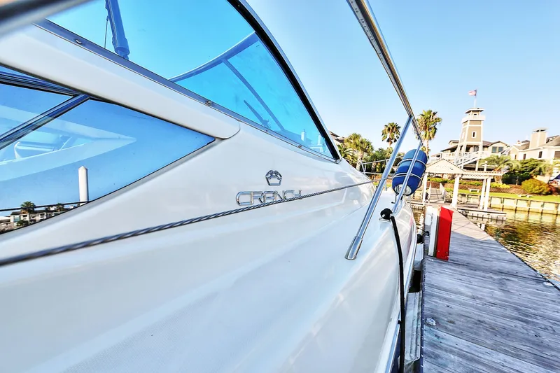 Slide: The Image of 2008 Cranchi Mediterranee 43 yacht docked at a scenic marina. - 5