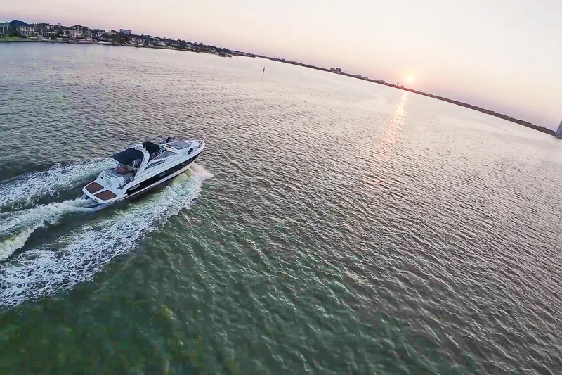 Slide: The Image of 2008 Cranchi Mediterranee 43 yacht cruising at sunset on open water. - 7