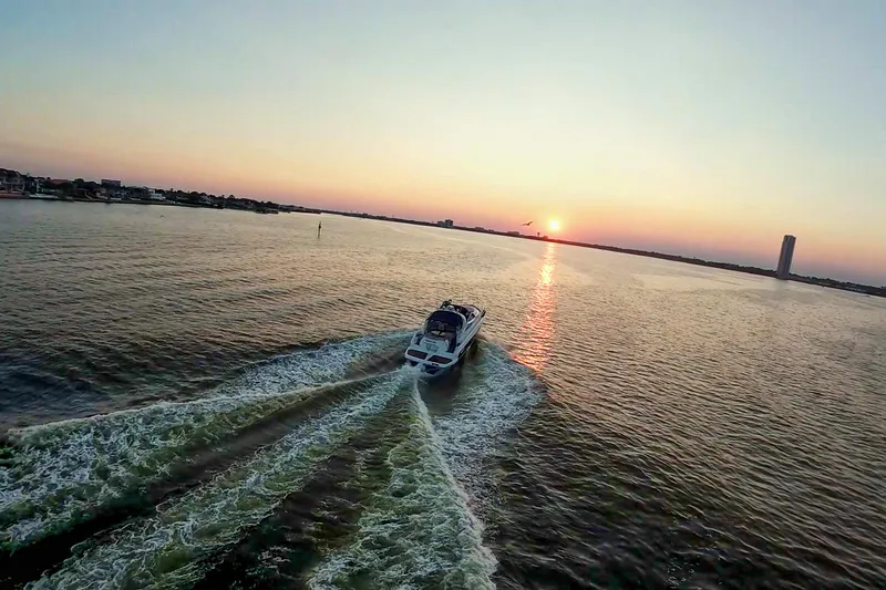 Slide: The Image of Cranchi Mediterranee 43 yacht cruising at sunset, 2008 model, serene water view. - 9