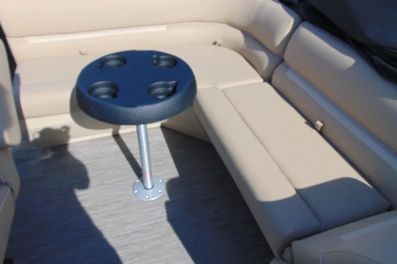 Slide: The Image of Luxurious seating area with cup holder table on 2026 Godfrey EX 1680 CX boat. - 10