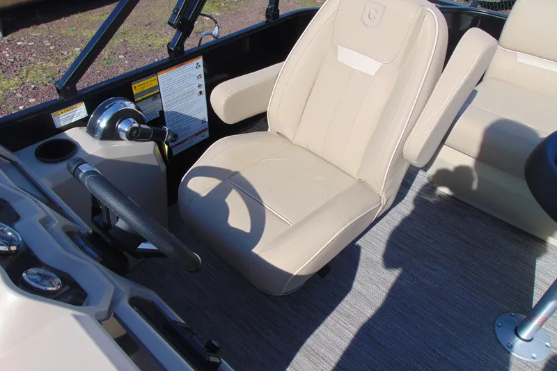 Slide: The Image of Captain's seat and controls of 2026 Godfrey EX 1680 CX boat. - 11