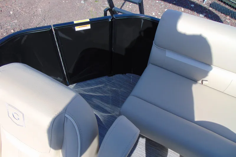 Slide: The Image of Interior seating of 2026 Godfrey EX 1680 CX boat with beige upholstery. - 12