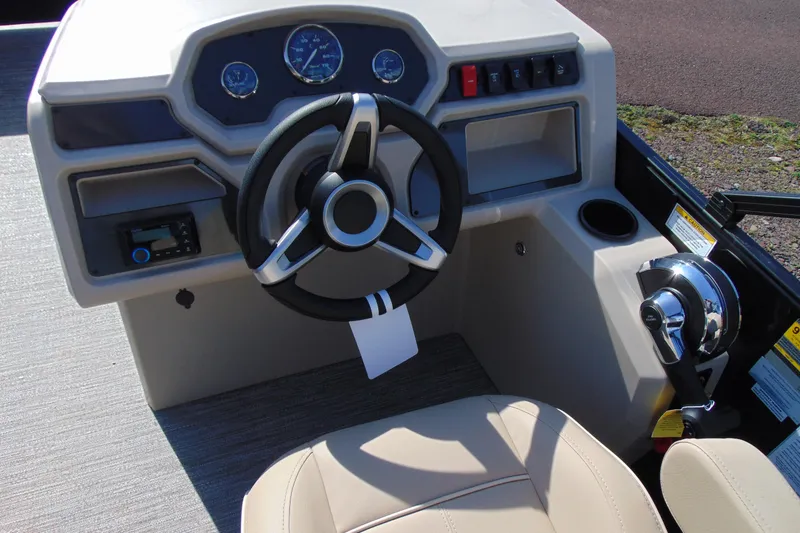 Slide: The Image of Steering console of 2026 Godfrey EX 1680 CX boat with modern controls and gauges. - 13