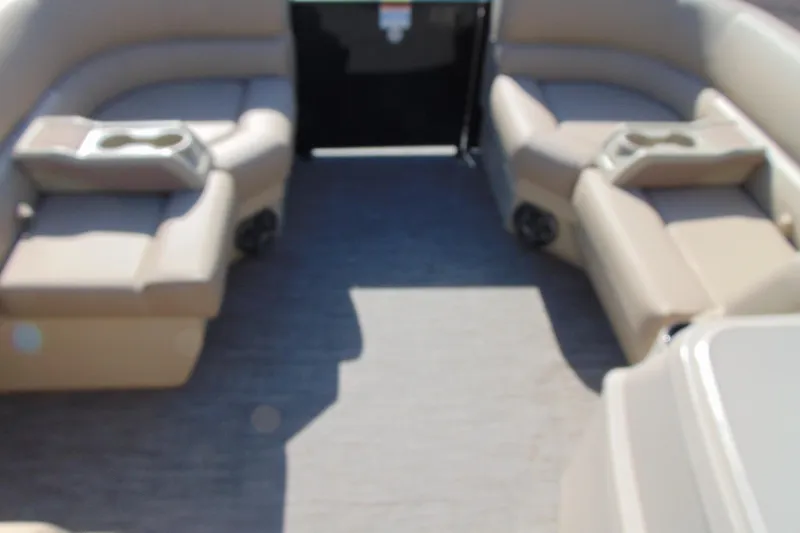 Slide: The Image of Interior of 2026 Godfrey EX 1680 CX boat with beige seating and cup holders. - 6