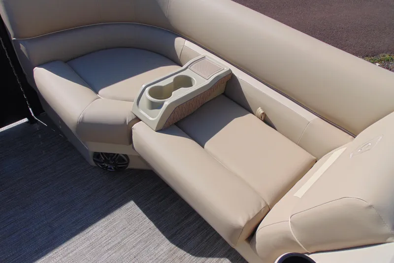 Slide: The Image of Luxurious beige seating with cup holders on a 2026 Godfrey EX 1680 CX boat. - 7