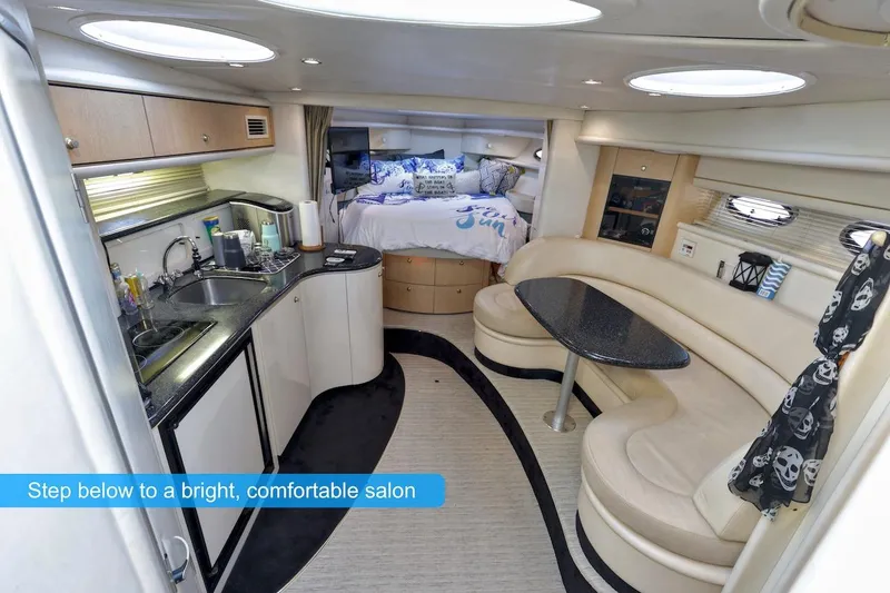 Slide: The Image of Interior of 2000 Maxum 3700 SCR yacht with kitchen and seating area. - 11