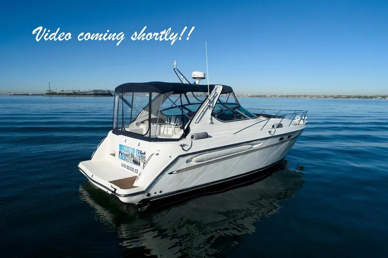 Slide: The Image of 2000 Maxum 3700 SCR yacht on calm water, clear sky, "Video coming shortly" text. - 3