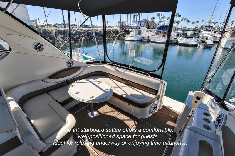 Slide: The Image of Luxurious 2000 Maxum 3700 SCR yacht interior with comfortable seating and scenic marina view. - 5