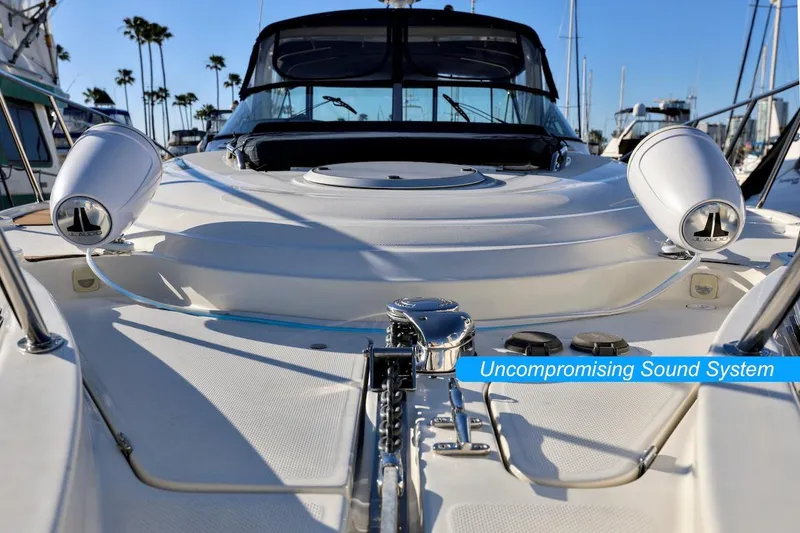 Slide: The Image of 2000 Maxum 3700 SCR yacht with premium sound system, docked in a marina. - 9